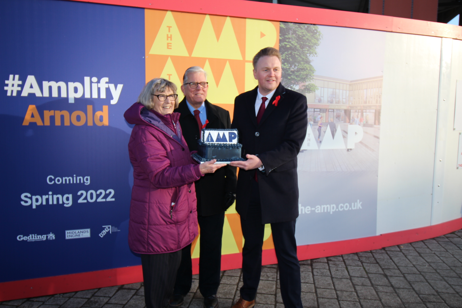 From left to right - Councillor Jenny Hollingsworth, Councillor John Clarke and Councillor Michael Payne in front of hoardings to promote 