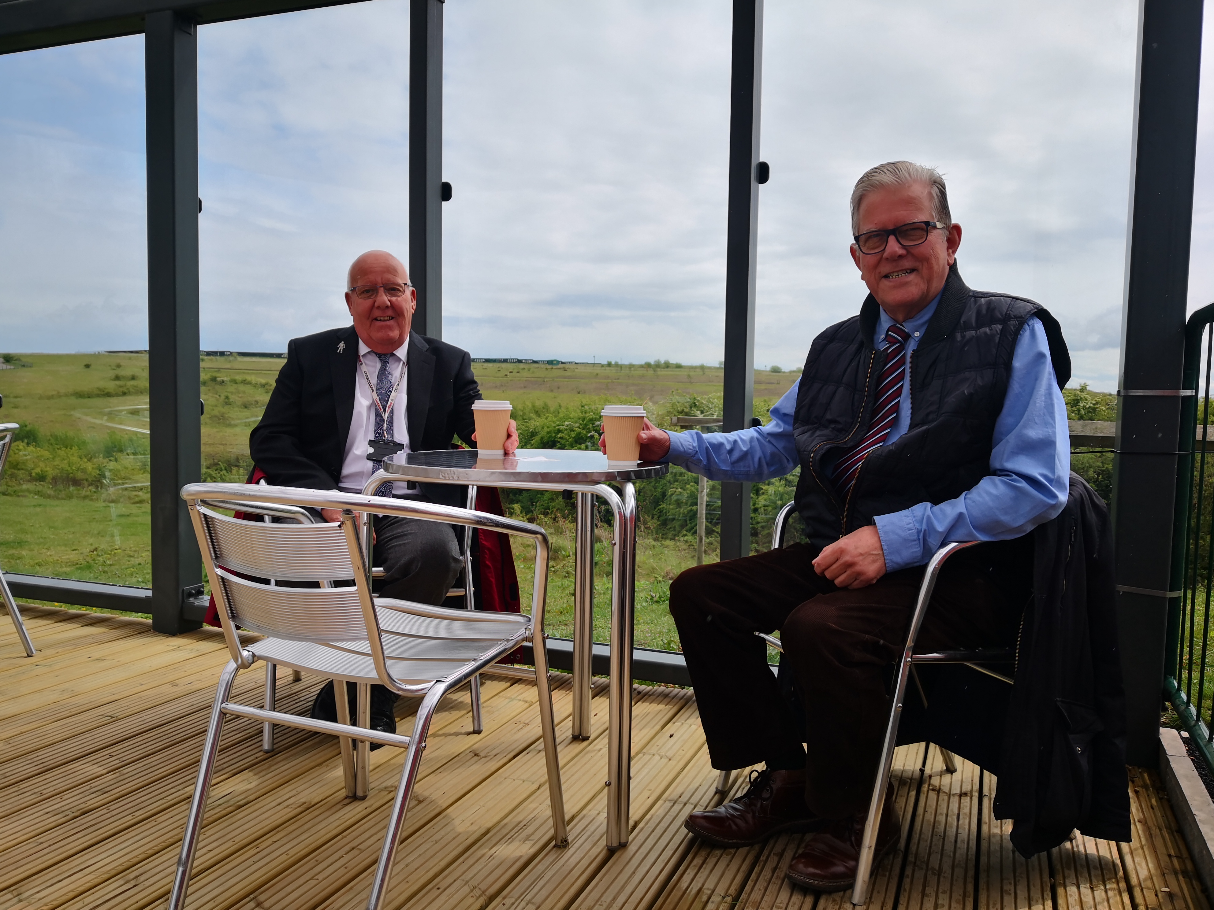 Councillor Gary Gregory and Councillor John Clarke sat at the outdoor seating area for Cafe1899 at Gedling Country Park