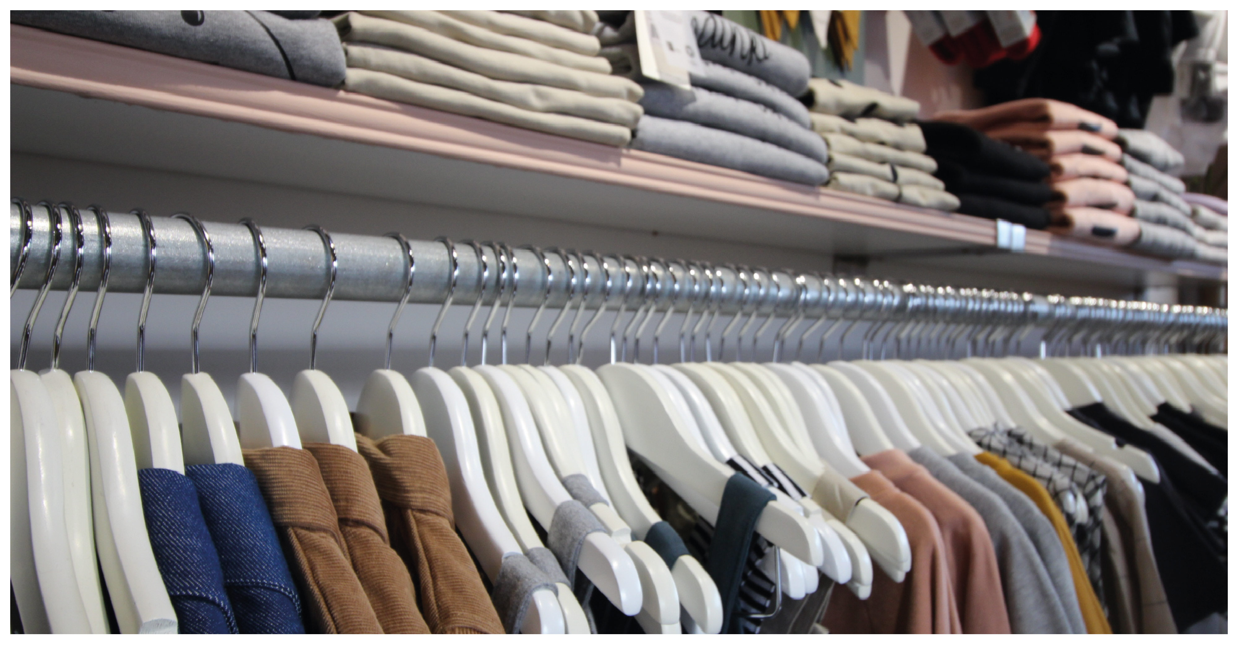 cloths on a rail in a clothing shop